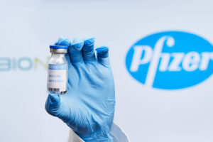 Doctor holding BioNTech and Pfizer Covid-19 vaccine