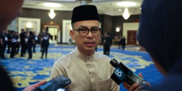 Communications minister fahmi fadzhil mcmc